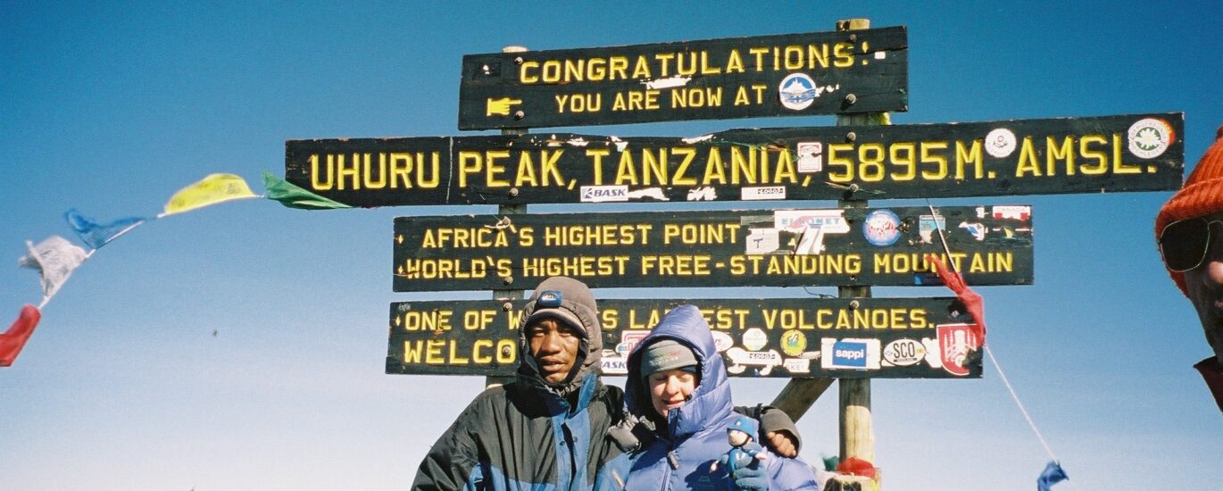 Zoe on top of Mount Kilimanjaro